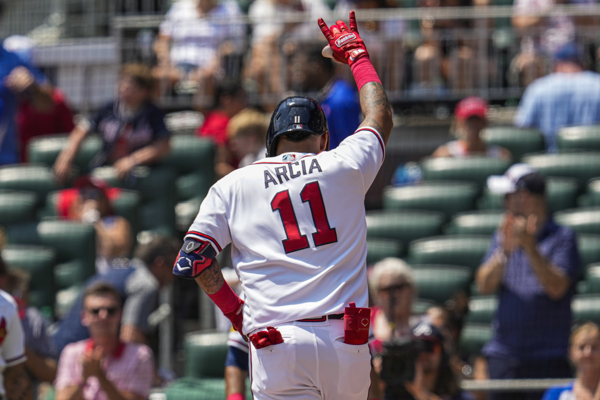 Aug 20, 2023; Cumberland, Georgia, USA; Atlanta Braves shortstop Orlando Arcia (11) reacts after hitting a home run against the San Francisco Giants during the second inning at Truist Park.